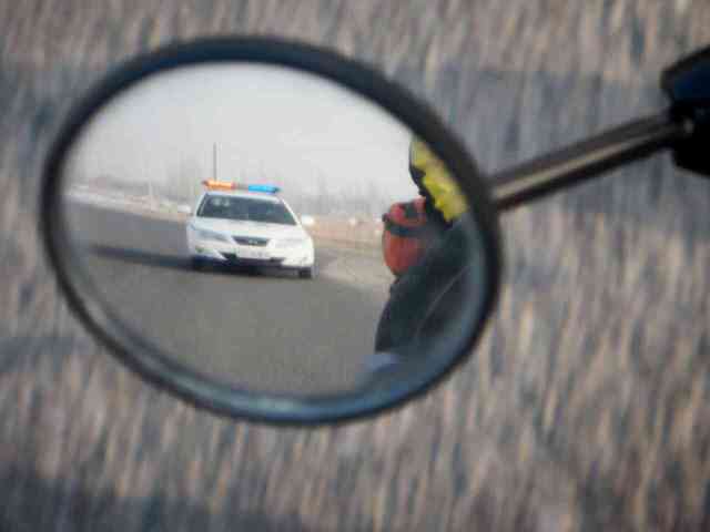 Police escort on the way to Luntai, 11 Jan 15