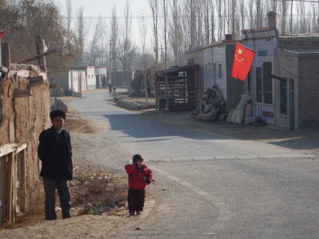 Passing through a Uighur village, 8 Jan 15
