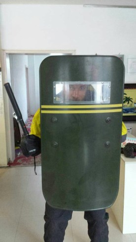 Only in China will they hand a foreigner a riot shield and taser to try out